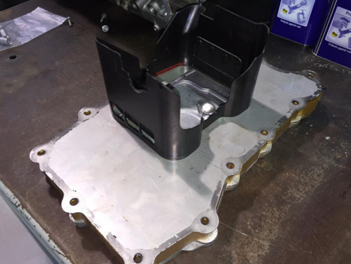 Install the modified plastic baffle — photo 1