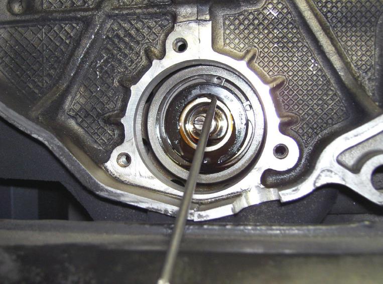 Remove the outer seal on the larger bearing — photo 1