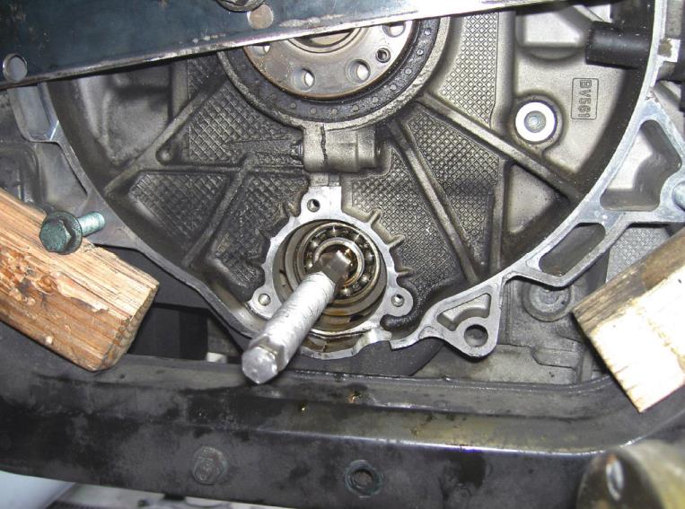 Attach the bearing removal tool bolt — photo 1