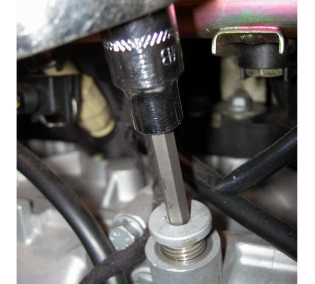 Remove the oil port plug — photo 1