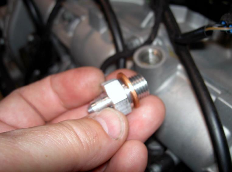 Install the oil port adapter — photo 1
