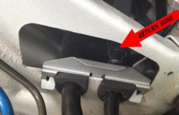 Identify the low-pressure return hose — photo 2