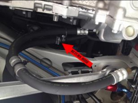 Connect the first return hose — photo 4